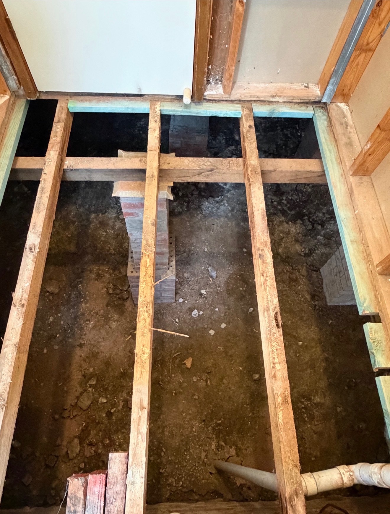 Floor lifted back to joists to assess the subfloor