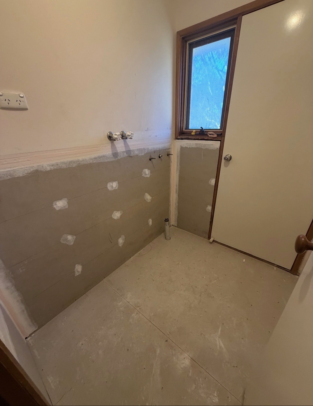 Walls patched, sheeted and prepared for waterproofing